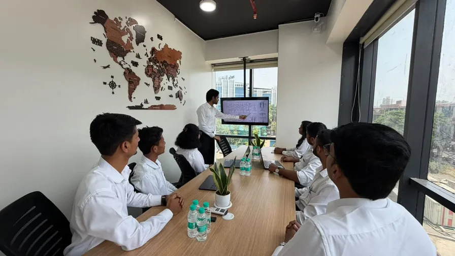 Engineering team reviewing project drawings in a meeting room