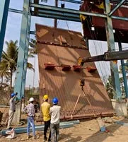 Waterwall panel being lifted into position on site